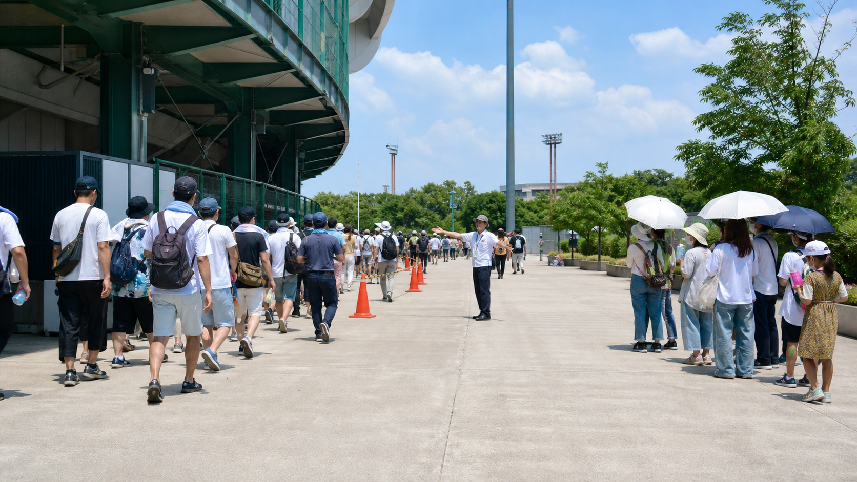 球場外で朝の部の退場と午後の部の来場が分かれるイメージ